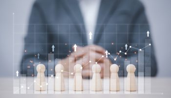 Teamwork and idea concept, Successful team leader, Businessman hand choose people standing out from the crowd.
